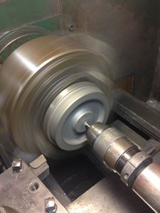 The wheel casting is mounted in the four jaw chuck. First operation is to center drill.