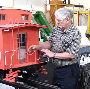 Bill Dykeman fitting a new aluminum door to his 2.5 inch scale caboose.