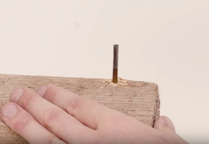 File:Wintergatan leave drill embedded in wood block.PNG