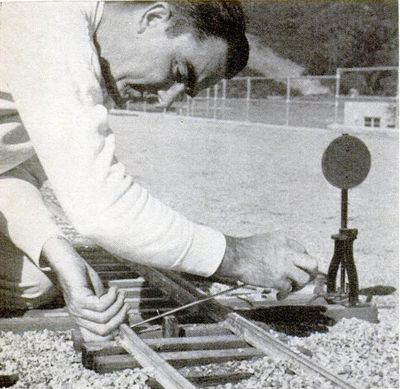 Miniature switch is installed on 1-1/2 inch track at Johnson's mountain. "Gandy dancers" work alternate Sundays. One club works on 1-1/2 inch track and the other on 3 inch track, getting them ready.