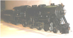 No. 17 - This very dark photo was published as part of a classified on the Discover Live Steam webpage. Has an axle and duplex pump with injector. Copper tender and boiler, piston valves, Baker gear.