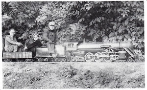 Horace Shaw at the throttle on the Whysall Light Railway during an open house in 1938, Bloomfield Hills, Michigan. The young man seated behind the tender is Hugh Pettis, son of Cliff Pettis. Photo by Cliff Pettis.