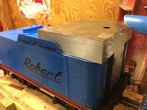 The temporarily constructed oil tank is tested for fit in the Allen Mogul tender.
