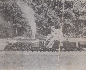 Walter S. Johnston and his No. 2031. She is 1-1/2 inch scale, 7-1/2 inch gauge and weighs 1440 pounds dry. She is the motive power for the Johnston Line, a 2000 foot pike having many curves and heavy grades. Train equipment consists of 3 flat cars, 3 gondolas, a tank car and caboose. Three more cars are under construction. From The North American Live Steamer, Number 1 Volume 9, 1956.