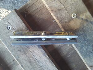 A simple rail joiner gauge can be made by drilling a hole in the center of two rail joiners, then attaching them together with screws, washers and nuts.