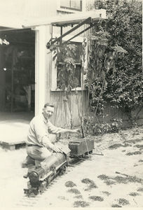 Gordon Corwin loading his 3/4 inch scale Little Engines 4-8-4 onto the track of his home layout, circa 1957 in Southern California. Photo provided by Stephen Quandt.