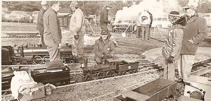 IBLS 1972 Meet at Pioneer Valley Live Steamers. In the center, kneeling & looking at the camera is Bill Van Brocklin with his beautiful 4-4-0 named "Fire Queen." It ran like a watch, as all his engines. To the left of Bill is Paul Ealsons Pacific 6870. The gent without a hat is the late Frank Dreshler from Whitestone, NY. Behind Bill Van Brocklin is Keith Muldowney form New Jersey Live Steamers. In the white sweater with his back to the camera is Ben Nixon talking to the late Jim Maxheimer.