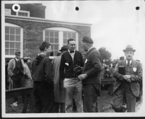 Charlie Purinton is the young man to the left of center (with the hooded jacket), at the age of 16. Laverne Langworthy is the gentleman in the far right of the image walking towards the camera.