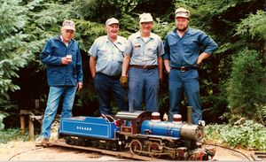 With Bill Van Brocklin's new 4-4-0 on the turntable, the guys look on. Charlie Purinton, George Diamond, Bill Van Brocklin and Cap Purinton. August 22, 1987 meet at Carl Purinton's Boxford Outer Belt track. Photo by Bob Hornsby.