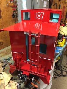 A vinyl negative was cut and used as a paint mask for the large "187" on this side of the cupola. I used positive while vinyl letters on the other side, and they both turned out well. Note the addition of details, such as hand rails, ladder and brake wheel.