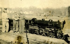 The "crew" comparing watches before a run on the 15 inch gauge Riverside & Great Northern R.R. at Janesville, Wisconsin. The engine is an Atlantic type equipped with Rotary Valve Gear and the crew reading from right to left are: Bob Stenholm, Engineer, Norman Sandley, Fireman and the late Oscar Dahlgren, Conductor. From "The Live Steamer", November 1951.